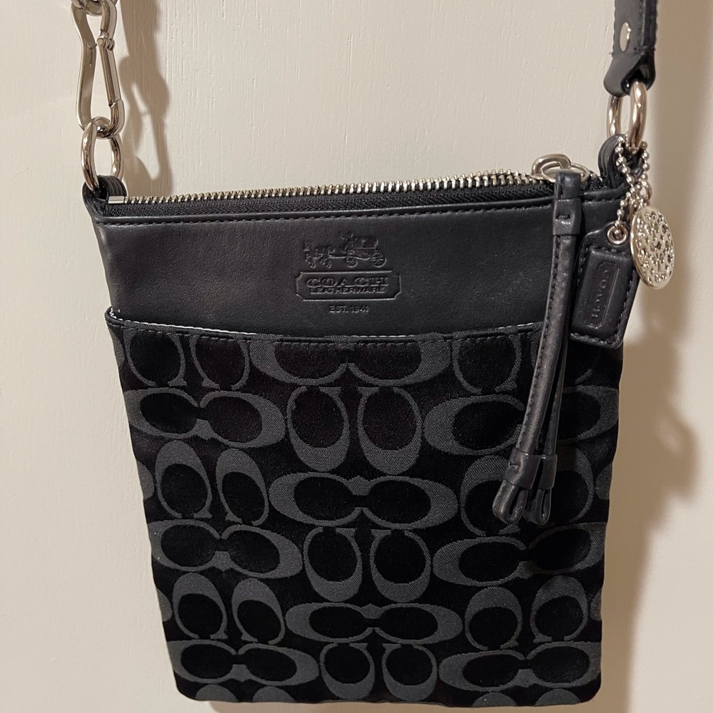 Coach!  Ladies black signature canvas crossover bag.  EUC